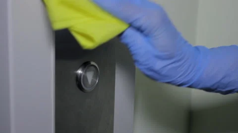 Sanitize disinfection spray elevator push button Stock Footage 131161294