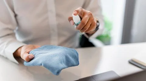 Sanitizing and cleaning the surfaces of devices before touching or using to a Stock Photos