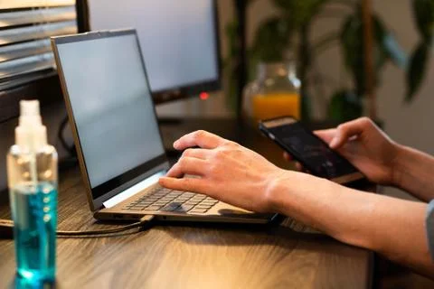 Sanitizing computer or laptop keyboard coronavirus protection Stock Photos