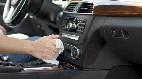 Sanitizing Vehicle Interior and Steering Wheel Stock Footage 127931068