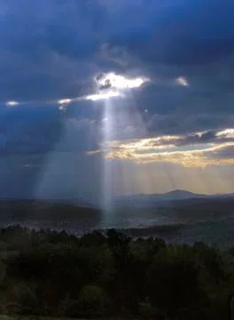 Sanrays over mountains Stock Photos