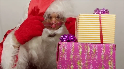 Santa is admiring of gifts Stock Footage 80389953
