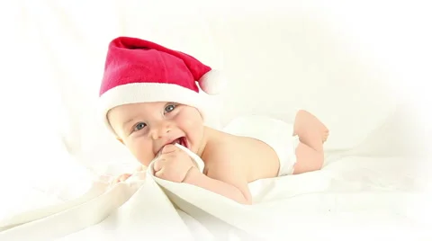 Santa baby playing with sheets Video stock 55764008