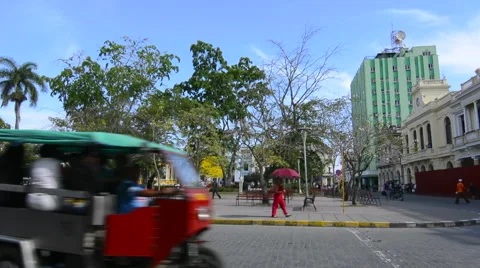 Santa Clara Cuba Main Square with locals walking and traffic around center of Stock-Footage 65358207