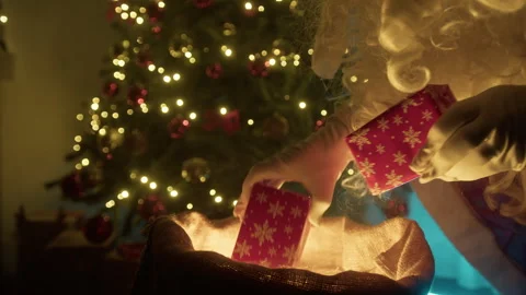 Santa Claus Checking The GIfts Inside The Christmas Bag Stock Footage 292966158