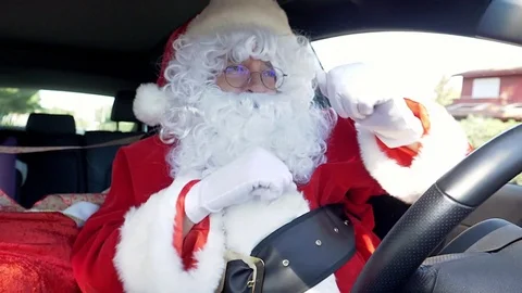 Santa Claus dancing like crazy happy while driving car super slow motion 4K Stock Footage 80358494