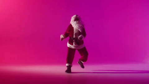 Santa Claus dancing on red background. Senior man in costume of Santa having fun Stock-Footage 164250585
