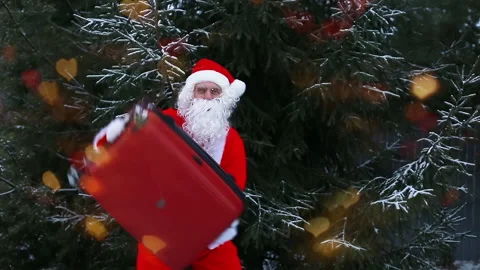 Santa Claus is dancing with a suitcase Stock Footage 166946571