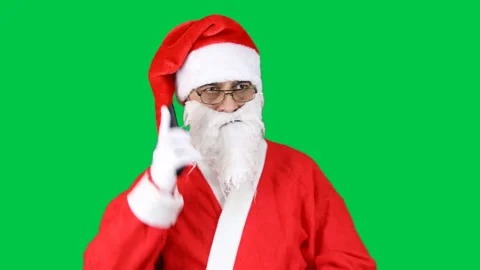 Santa Claus dial the number by making a call on the phone, on green background. Stock Footage 166319507