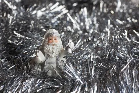 Santa Claus figure on silver sparkles backgraund. Stock Photos