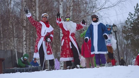 Santa Claus flash mob at the ski resort, Santa Claus on skis Stock Footage 260224631