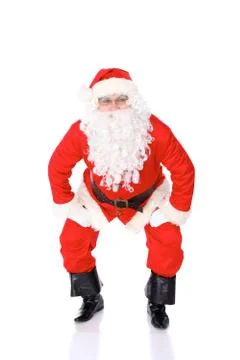 Santa Claus gesticulate while standing straight, isolated over white background Stock-Fotos