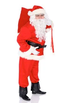 Santa Claus gesticulate while standing straight, isolated over white background Stock-Fotos