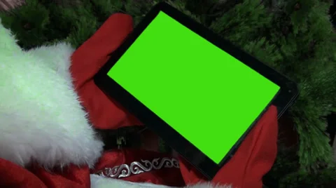 Santa claus gets on the hip a plane-table with a green screen Stock Footage 33221523