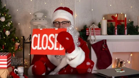 Santa Claus gets sad with closed sign. Open and closed business during lockdown. Stock Footage 166752063