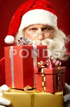 Santa Claus with gift boxes Stock Photos