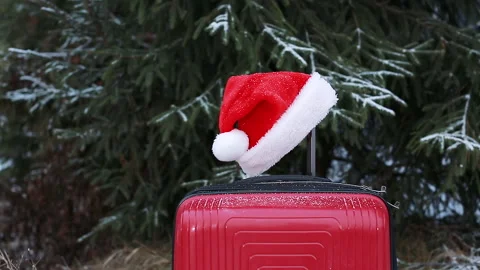 Santa Claus hat on a suitcase Stock Footage 166645157