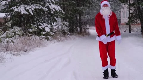 Santa Claus is having fun and funny dancing, shows acrobatic tricks, elemen.. Stock Footage 231035191