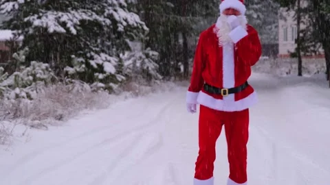 Santa Claus is having fun and funny dancing, shows acrobatic tricks, elemen.. Stock Footage 231035488