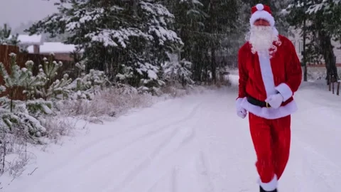 Santa Claus is having fun and funny dancing, shows acrobatic tricks, elemen.. Stock Footage 231035913