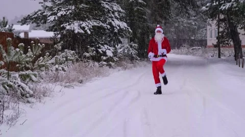 Santa Claus is having fun and funny dancing, shows acrobatic tricks, elemen.. Stock Footage 231035914
