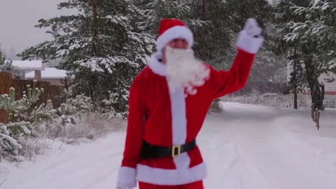 Santa Claus is having fun and funny dancing, shows acrobatic tricks, elemen.. Stock Footage 231063584