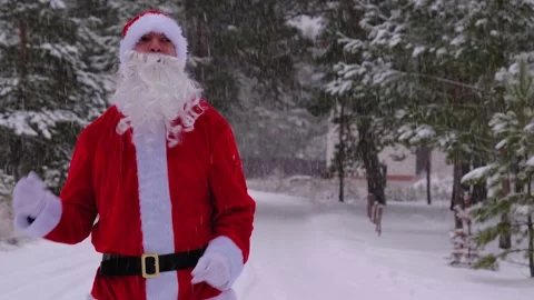 Santa Claus is having fun and funny dancing, shows acrobatic tricks, elemen.. Stock Footage 231095860