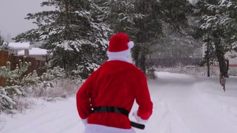 Santa Claus is having fun and funny dancing, shows acrobatic tricks, elemen.. Stock Footage 231105648