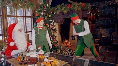 Santa Claus makes shot on camera Stock Footage 119265147