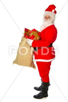 Santa claus with many presents Stock Photos