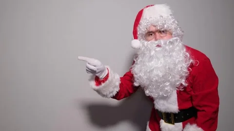 Santa claus pointing finger at camera and to the side 스톡 동영상 323903267