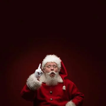 Santa Claus pointing up Stock Photos