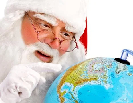 Santa Claus Points on the Globe Stock Photos