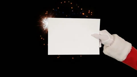 Santa Claus Presenting a White Sheet and sending a kiss against holiday fire Vidéo 140175576