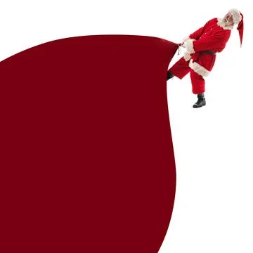 Santa Claus pulling huge bag of gifts Stock Photos