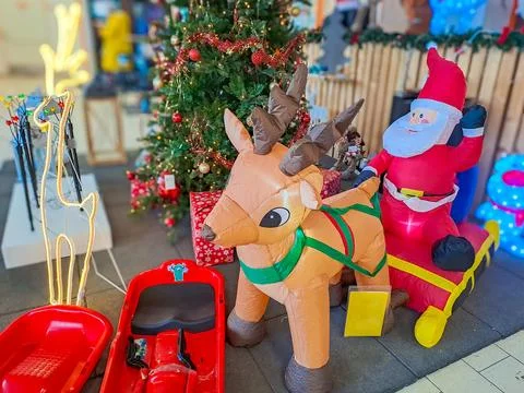 Santa Claus rides a sleigh pulled by a deer. Christmas tree toys. Czevh Stock Photos