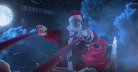 Santa Claus riding sleigh in night sky Stock Footage