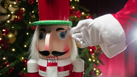 Santa Claus showing affection to a Nutcracker Stock Footage 257428995