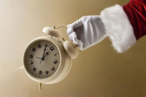Santa Claus showing countdown with clock on New Year's Eve Stock Photos