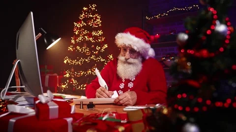 Santa claus sit table late night write letter ink feather Stock Footage 159895739