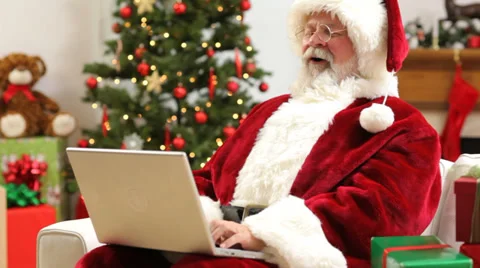 Santa Claus sitting with laptop computer Stock Footage 32718868