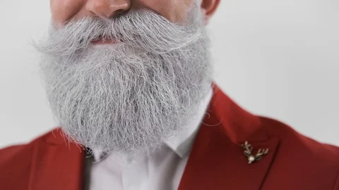 Santa Claus stroking his beard and mustache,smiling,concepts and Christmas Stock Footage 129867963