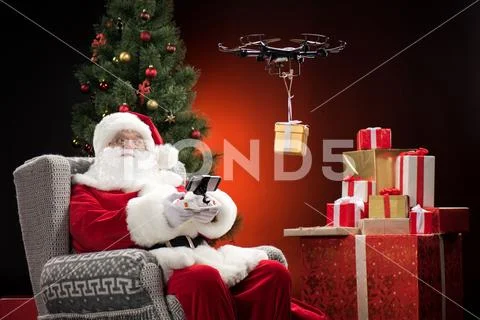Santa Claus using drone Stock Photos