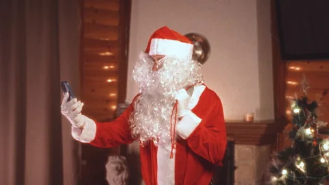 Santa claus using smartphone taking selfie Stock Footage 345740487