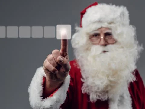 Santa Claus using a touch screen user interface Stock Photos