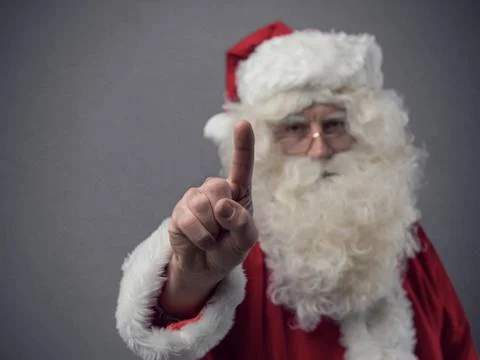 Santa Claus using a touch screen user interface Stock Photos