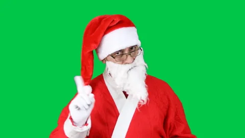 Santa Claus warning with admonishing finger gesture, saying no, be careful. Stock Footage 166319483