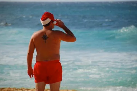 Santa Drinking on the Beach Stock Photos