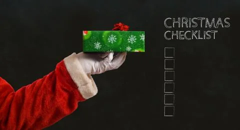 Santa hand and present Stock Illustration