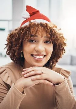 Santa hat, black woman and portrait of a female at home getting ready for Stock Photos